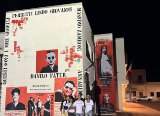 Il murale di Enea Polimeno sulla casa comunale di Melpignano scatena le proteste dell’ex sindaco. Il racconto di uno scambio politico